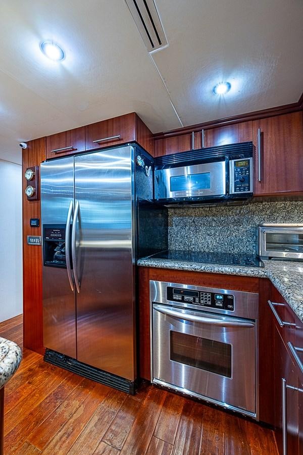 a kitchen with stainless steel appliances aboard FINALLY Yacht for Sale