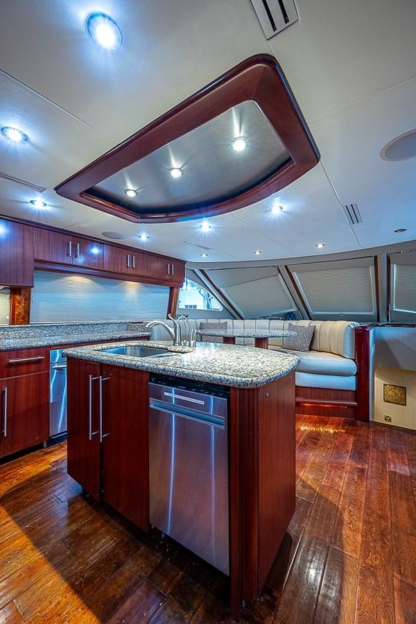 a kitchen with a large island aboard FINALLY Yacht for Sale