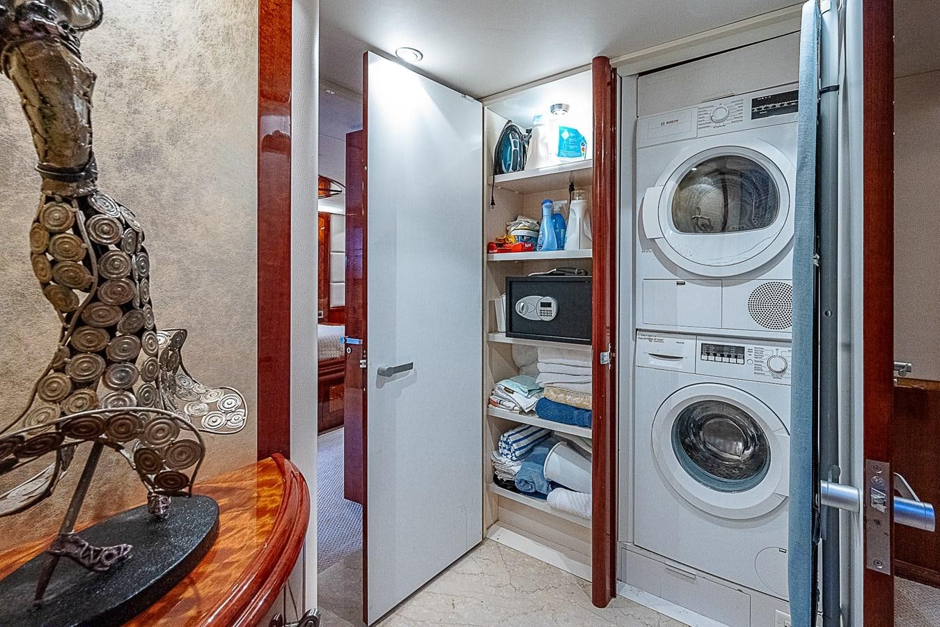a room with a washer and dryer aboard FINALLY Yacht for Sale