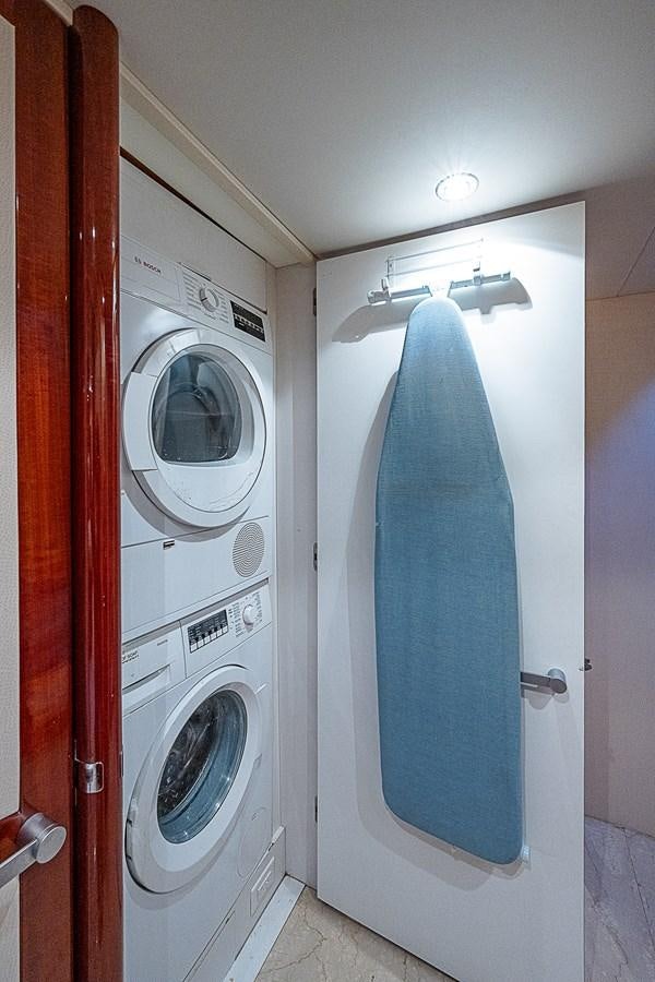 a washing machine in a room aboard FINALLY Yacht for Sale