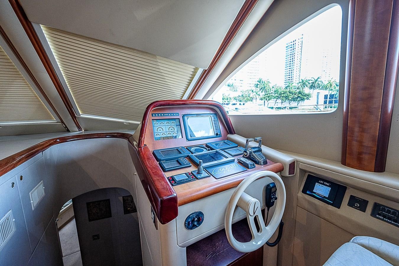 a person driving a car aboard FINALLY Yacht for Sale