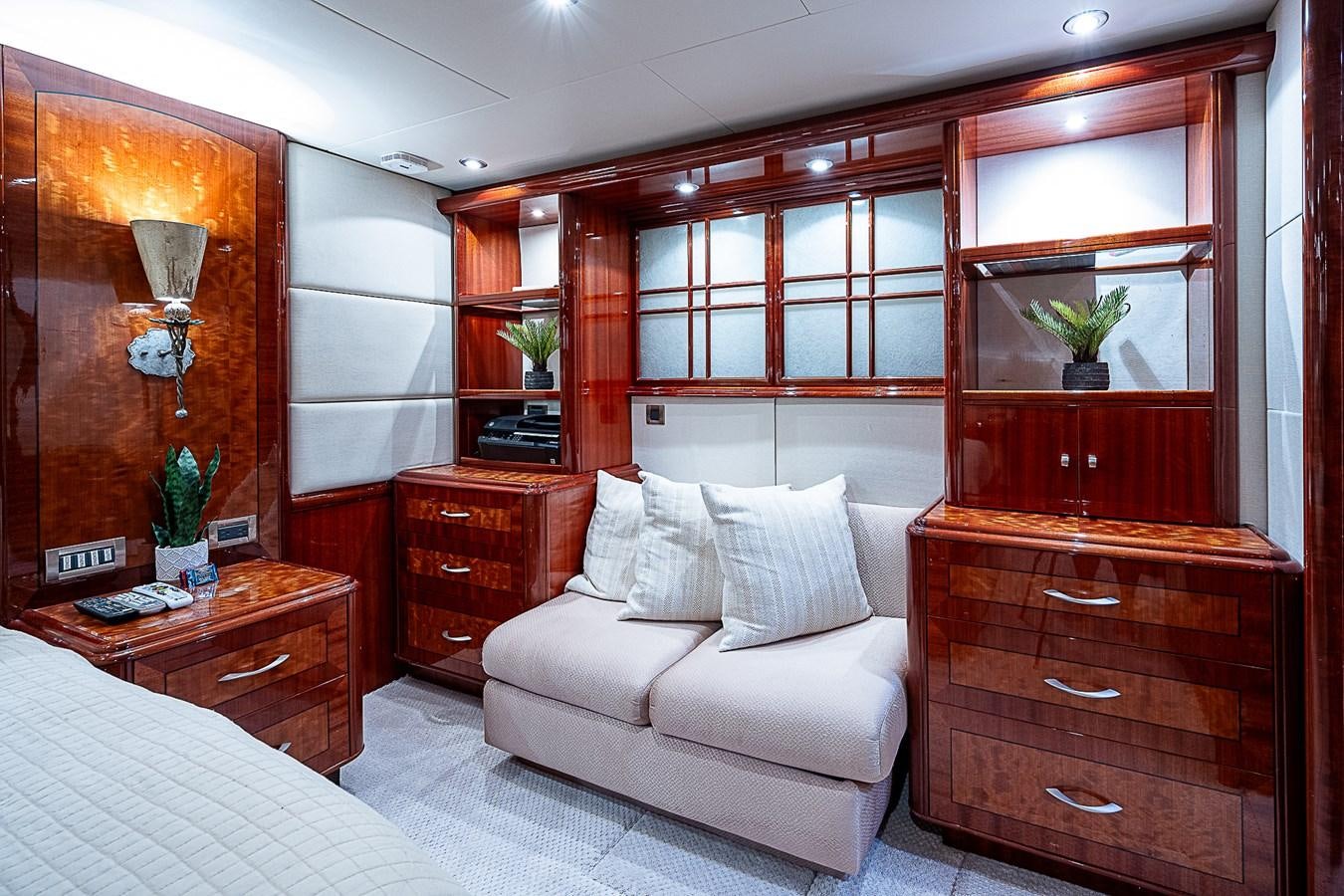 a room with a bed and a dresser aboard FINALLY Yacht for Sale