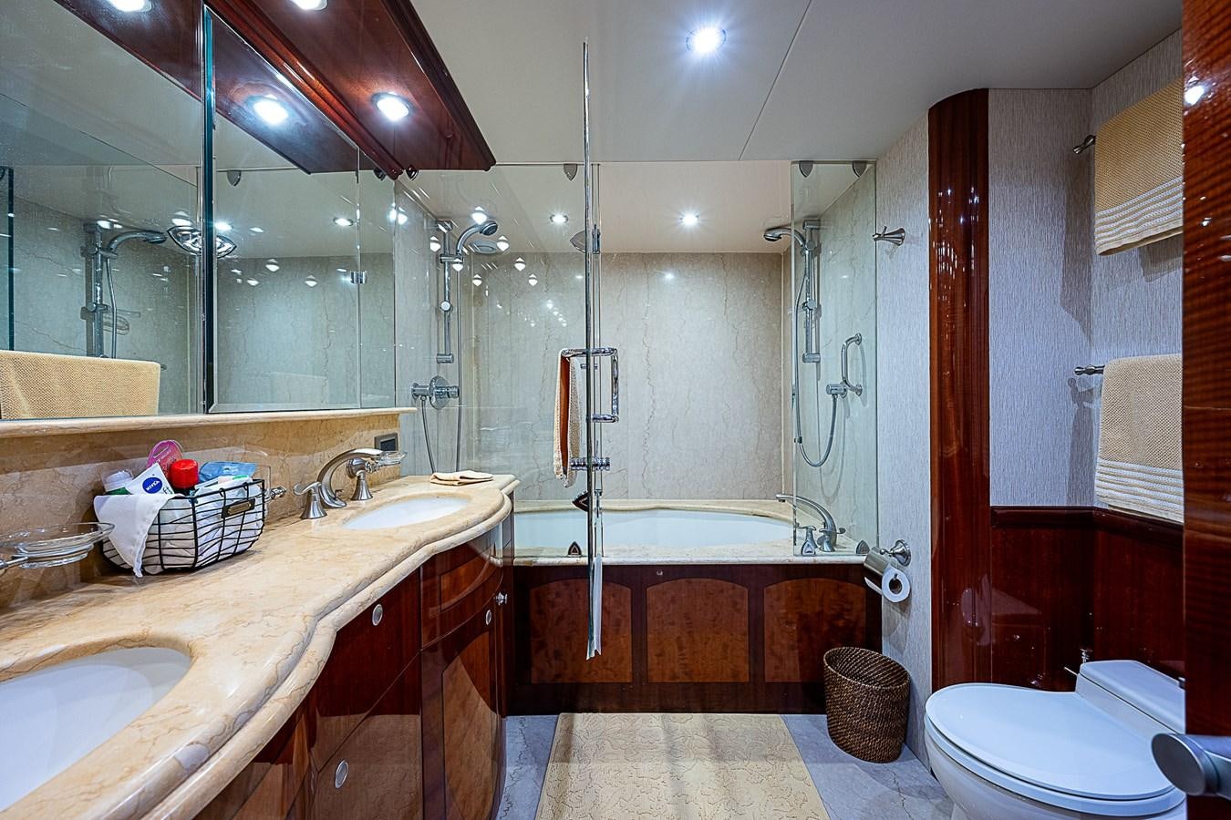 a bathroom with a tub sink and toilet aboard FINALLY Yacht for Sale