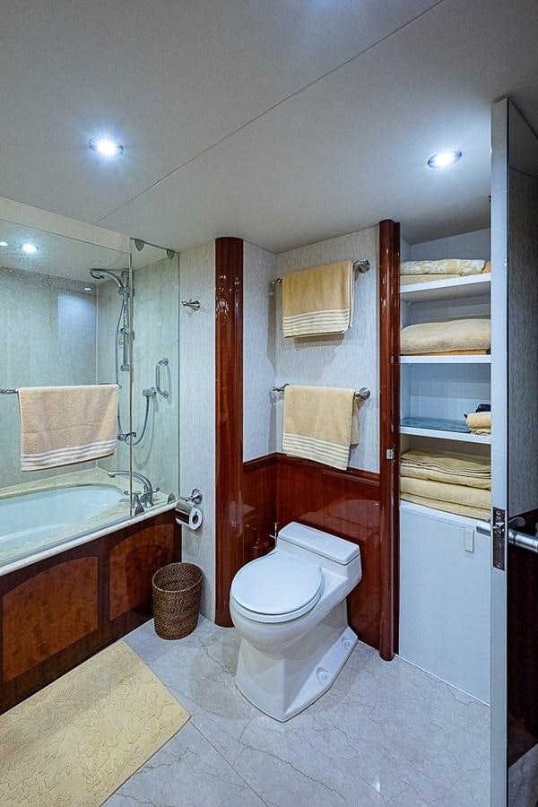 a bathroom with a toilet and a sink aboard FINALLY Yacht for Sale