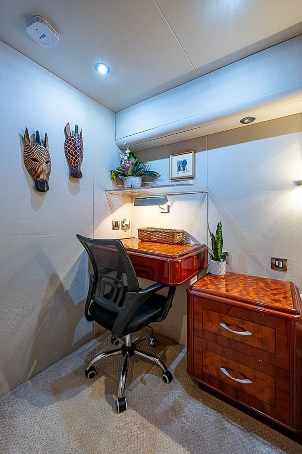 a room with a desk and a chair aboard FINALLY Yacht for Sale