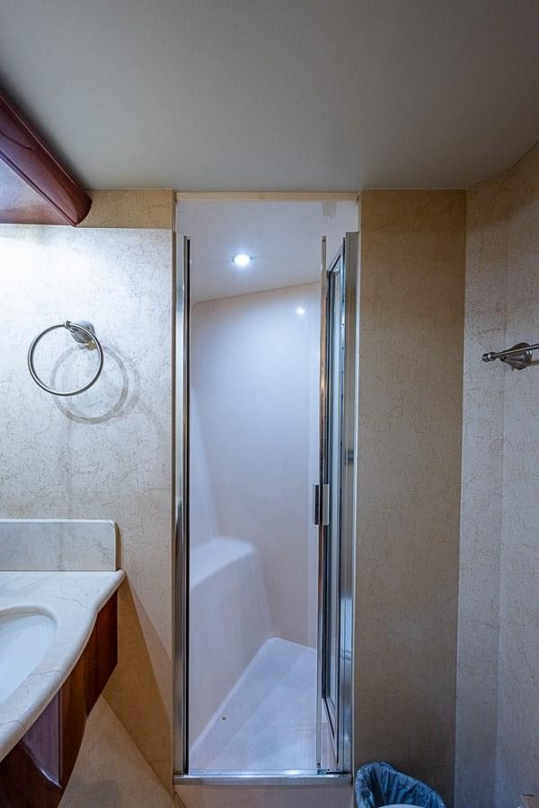 a bathroom with a shower unit and sink aboard FINALLY Yacht for Sale