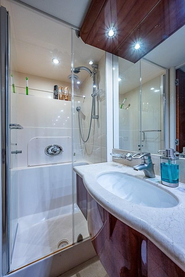 a bathroom with a sink and shower aboard FINALLY Yacht for Sale