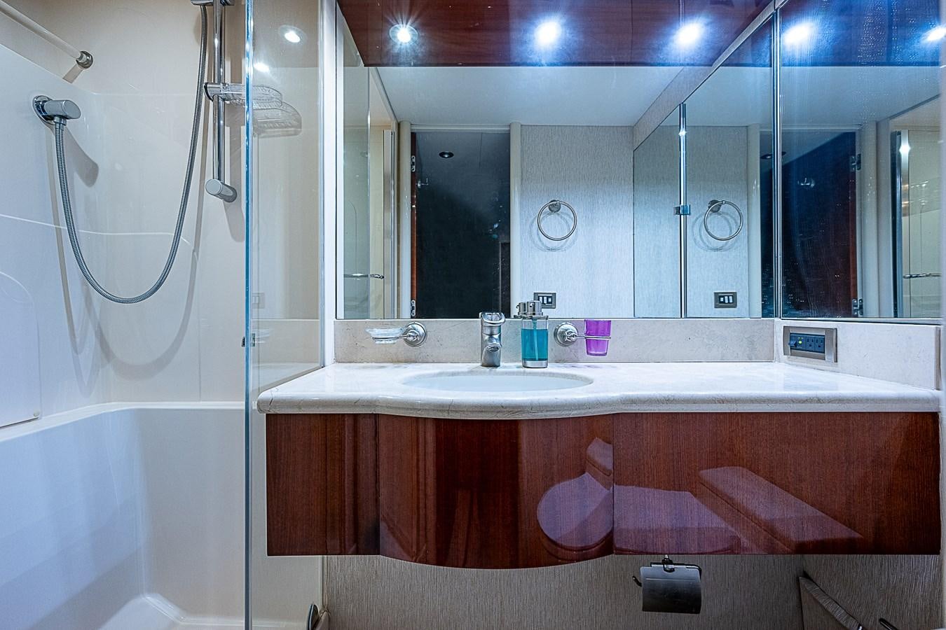 a bathroom with a bathtub and sink aboard FINALLY Yacht for Sale