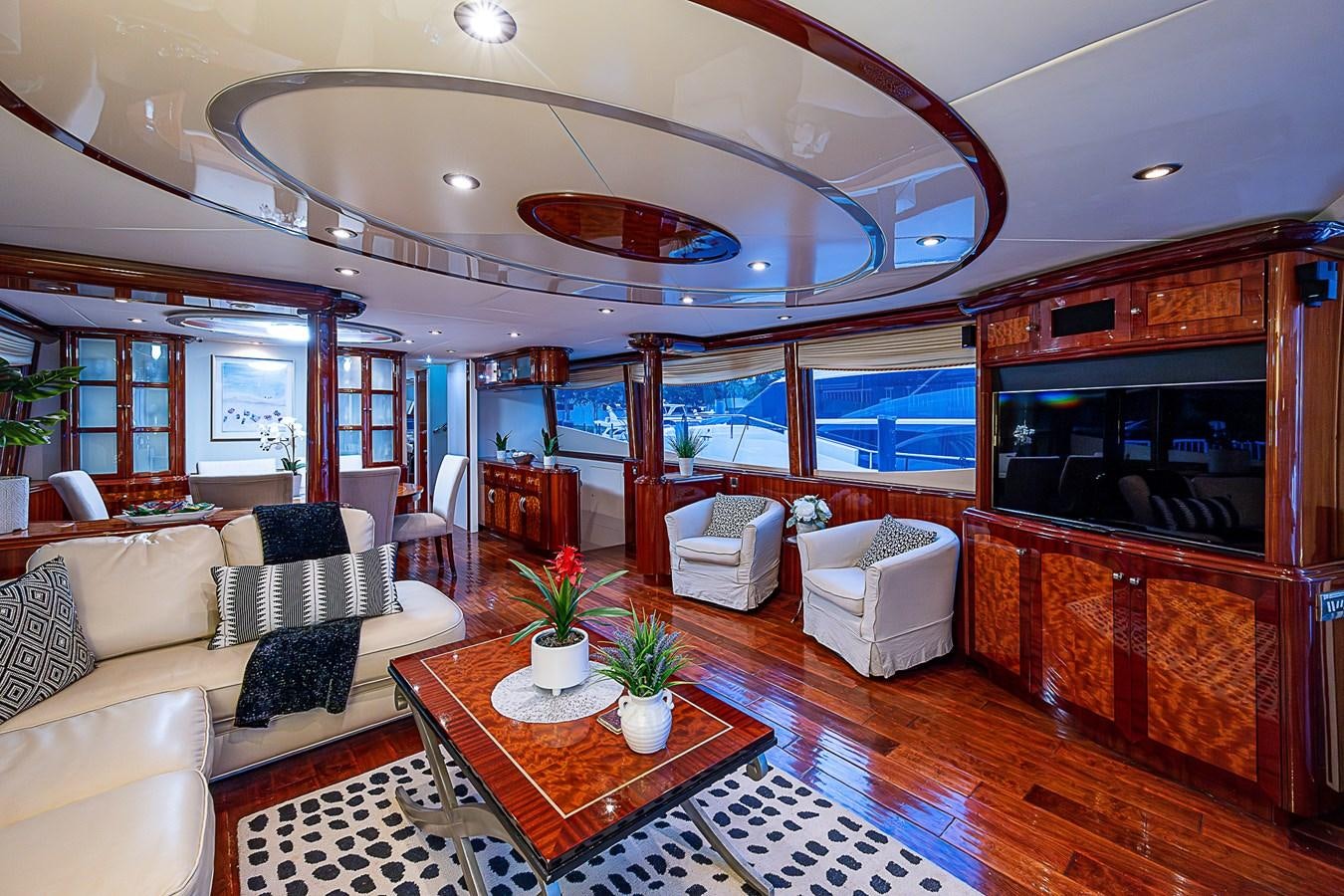 a living room with a large fireplace aboard FINALLY Yacht for Sale