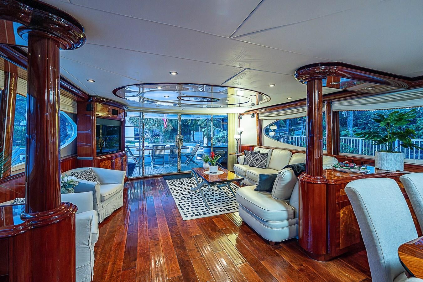 a living room with a wood floor aboard FINALLY Yacht for Sale