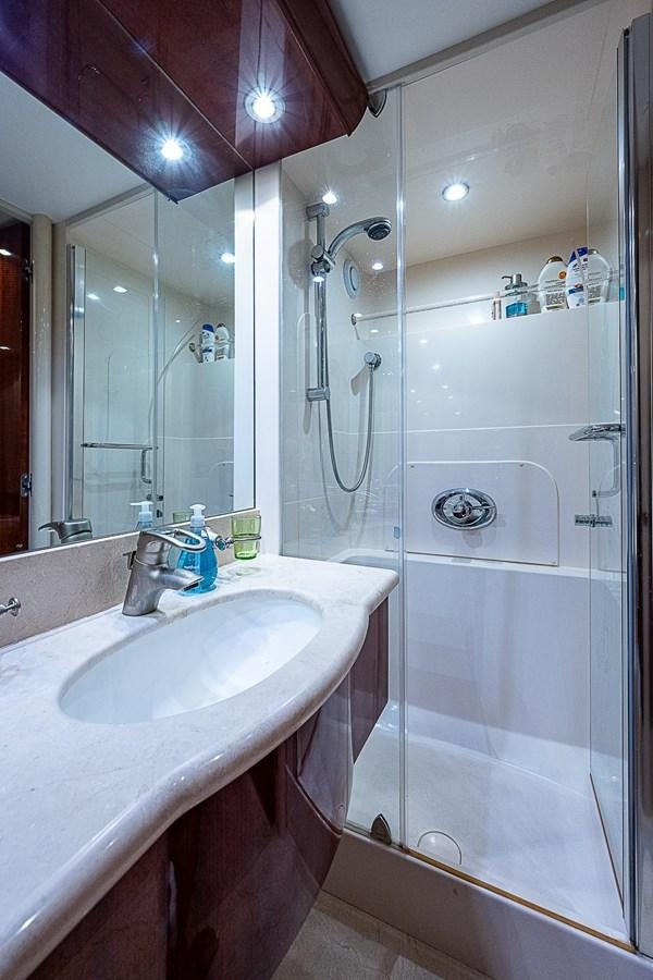 a bathroom with a shower and sink aboard FINALLY Yacht for Sale