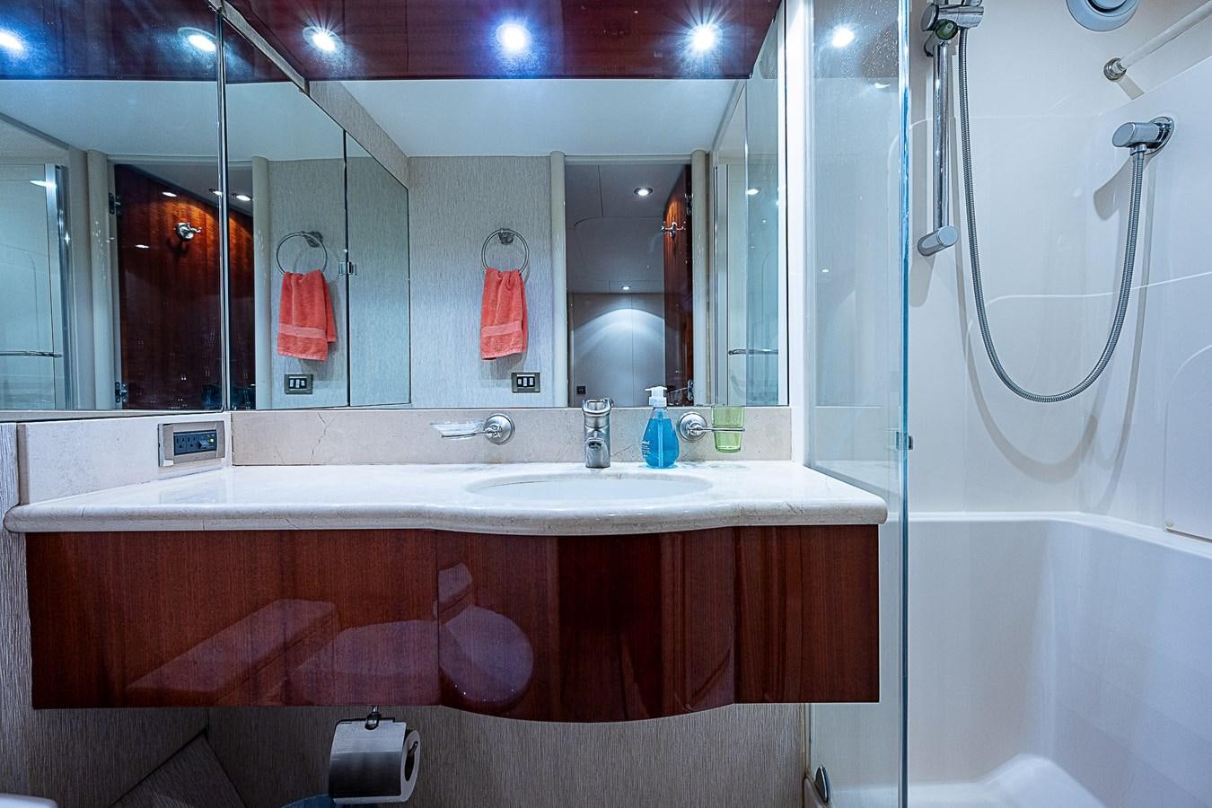 a bathroom with a bathtub sink and a mirror aboard FINALLY Yacht for Sale
