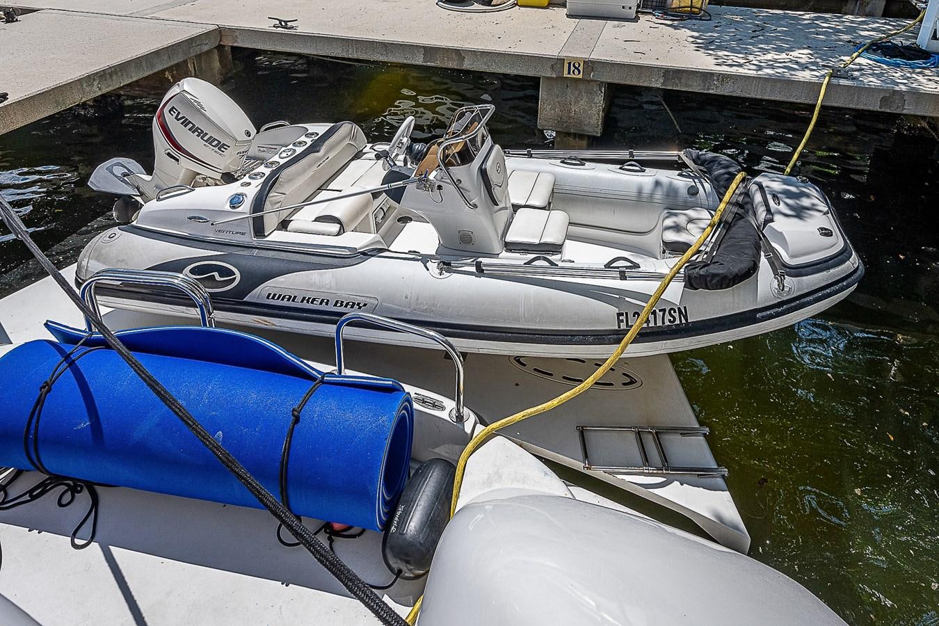 a boat with a motor attached to it aboard FINALLY Yacht for Sale