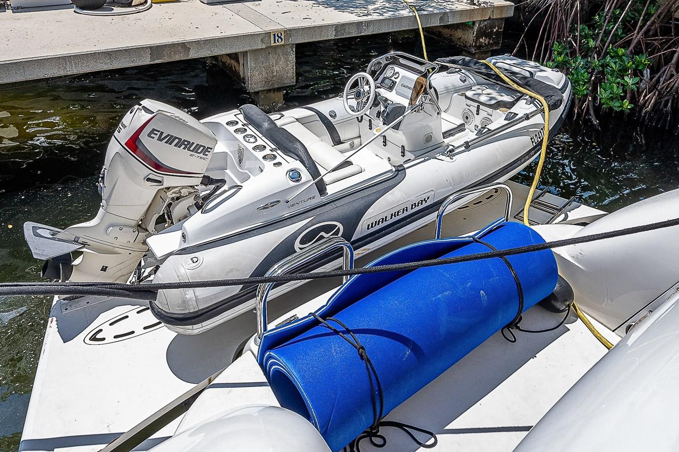 a boat with a motor aboard FINALLY Yacht for Sale