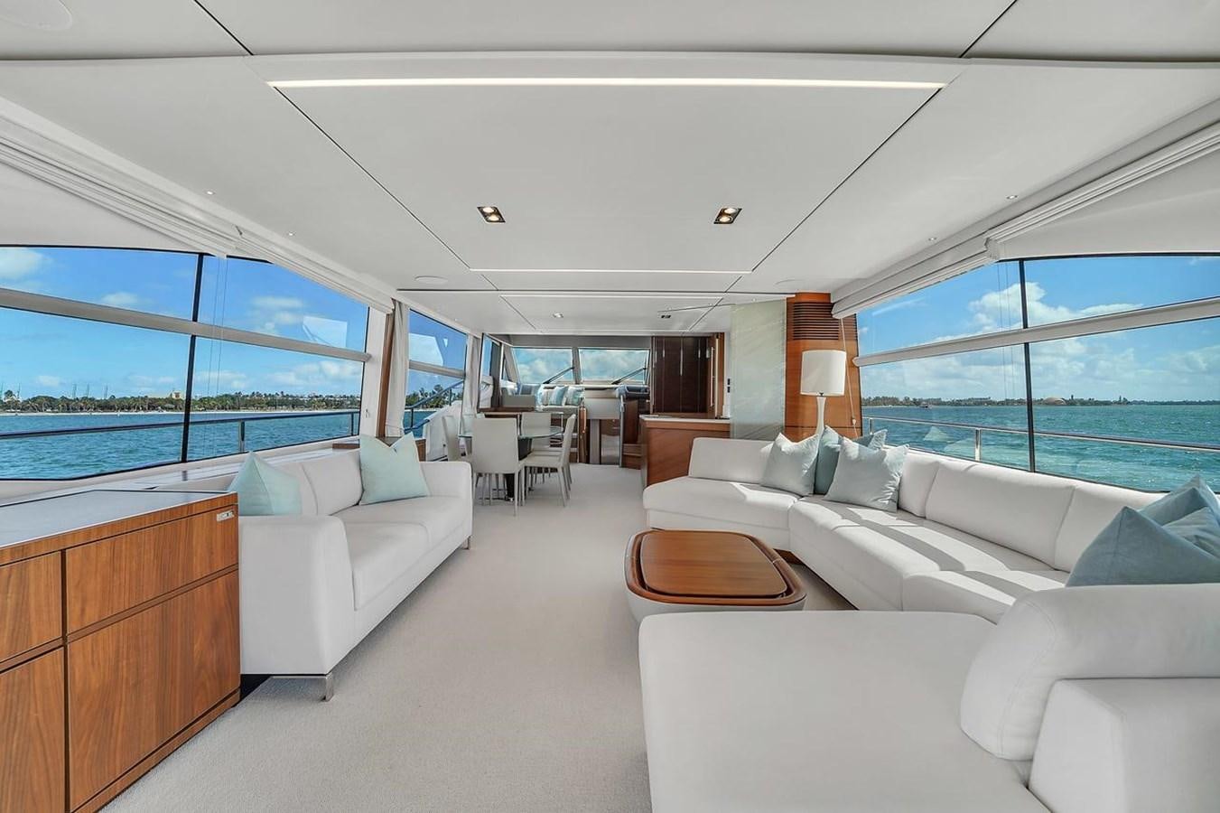 a living room with a large window aboard 78' PRINCESS Y78 2021 Yacht for Sale