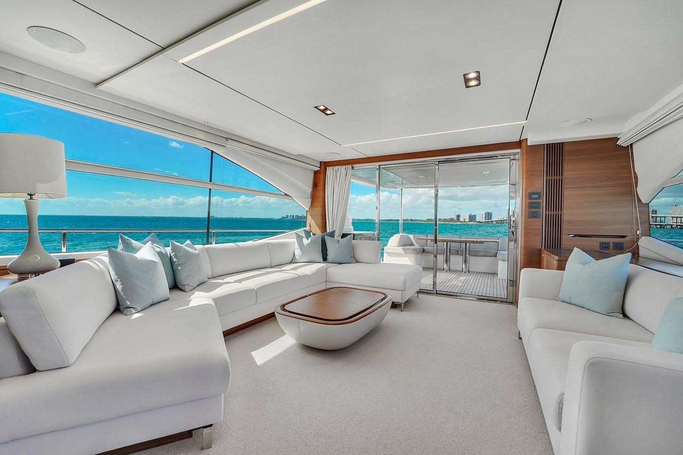 a living room with a large window aboard 78' PRINCESS Y78 2021 Yacht for Sale