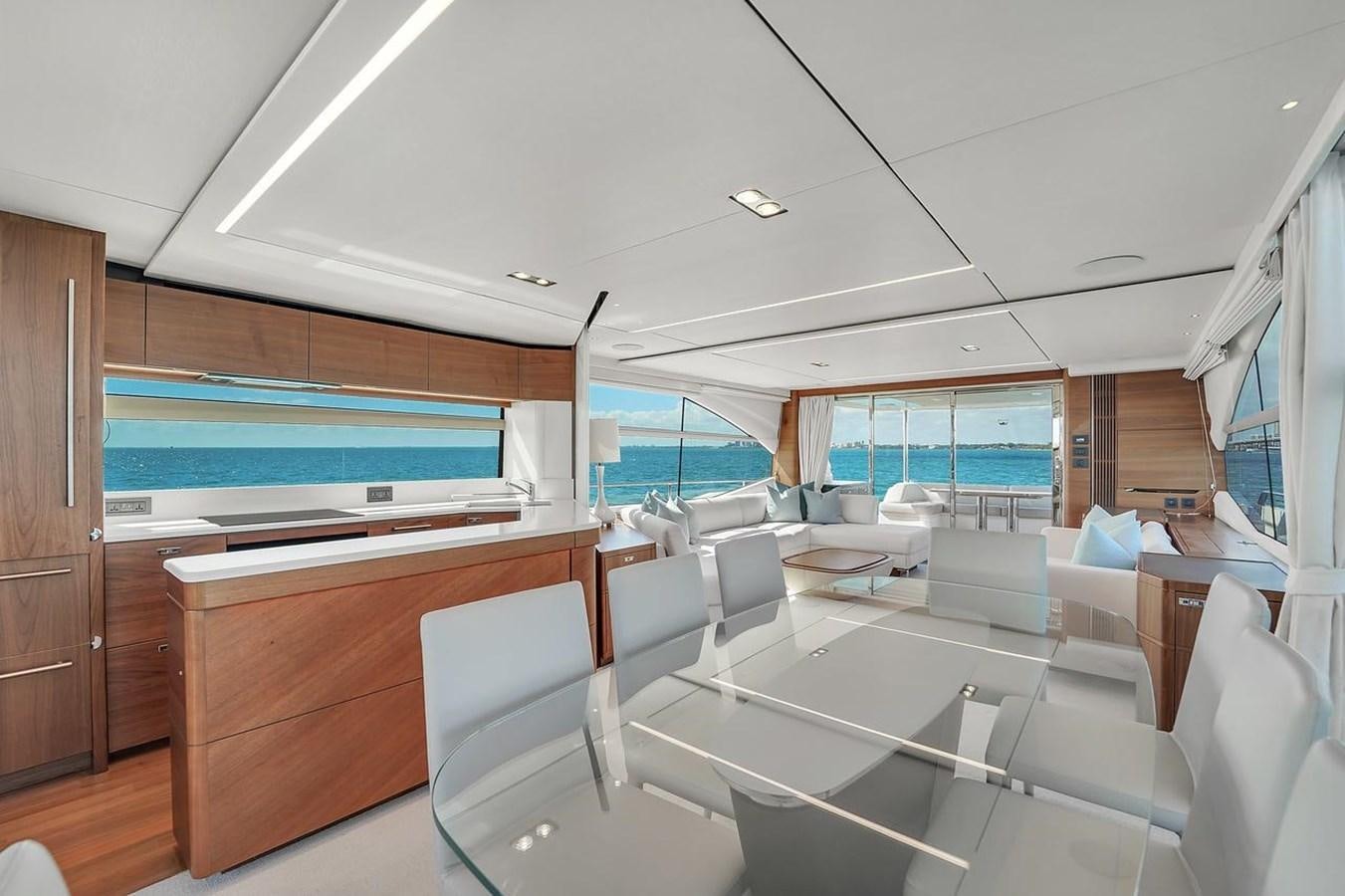 a room with a table chairs and a window aboard 78' PRINCESS Y78 2021 Yacht for Sale