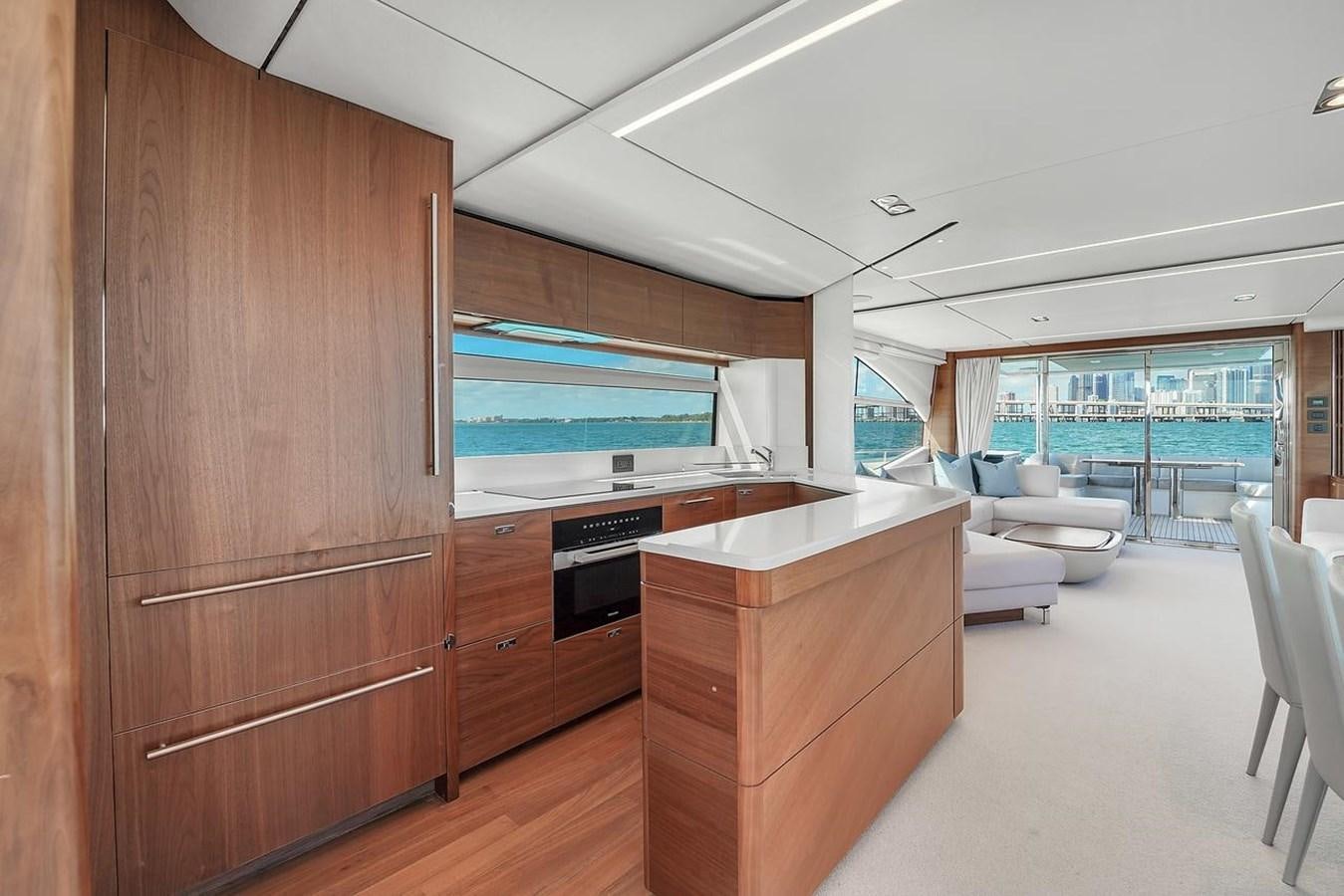 a room with a wood cabinet and a large window aboard 78' PRINCESS Y78 2021 Yacht for Sale