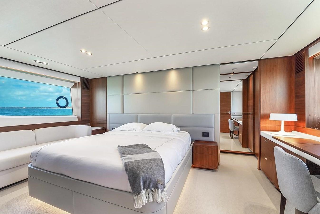 a room with a bed and a desk aboard 78' PRINCESS Y78 2021 Yacht for Sale