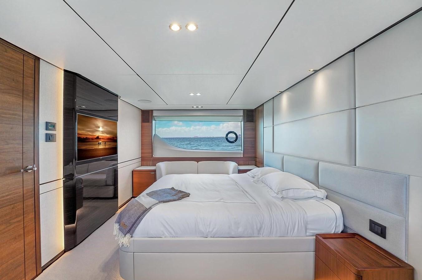a room with a bed and a television aboard 78' PRINCESS Y78 2021 Yacht for Sale
