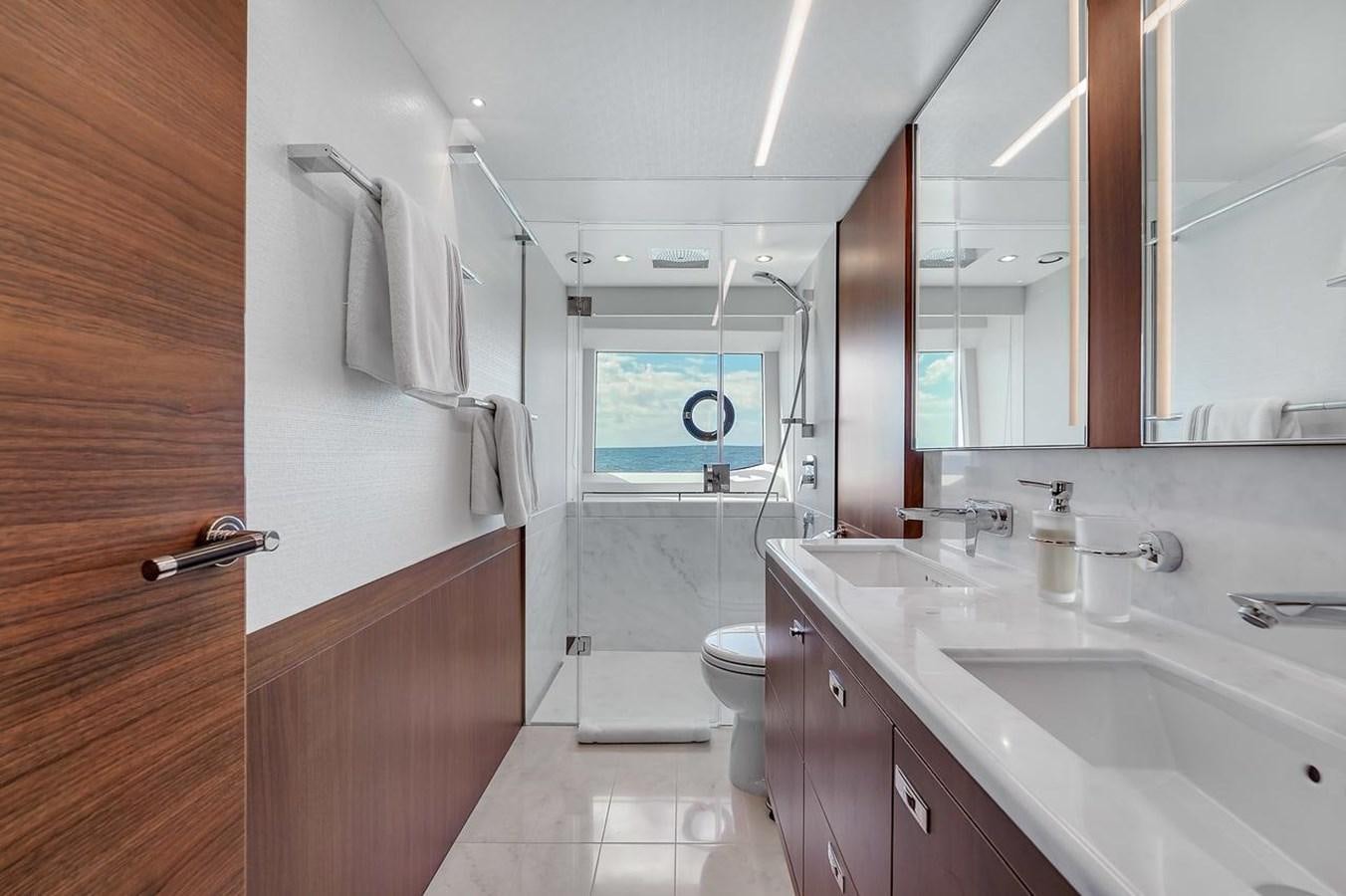 a bathroom with a sink and a toilet aboard 78' PRINCESS Y78 2021 Yacht for Sale