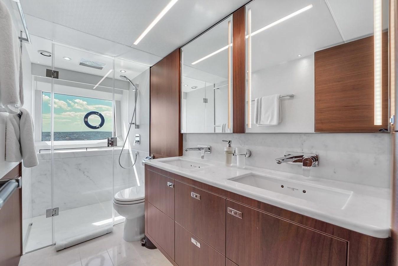 a bathroom with a sink and a toilet aboard 78' PRINCESS Y78 2021 Yacht for Sale