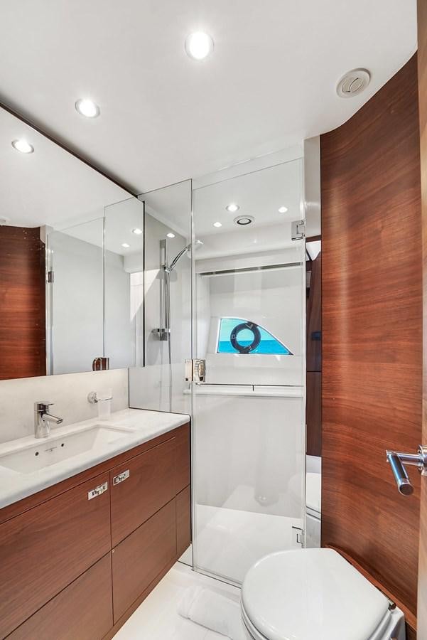 a bathroom with a shower and a toilet aboard 78' PRINCESS Y78 2021 Yacht for Sale