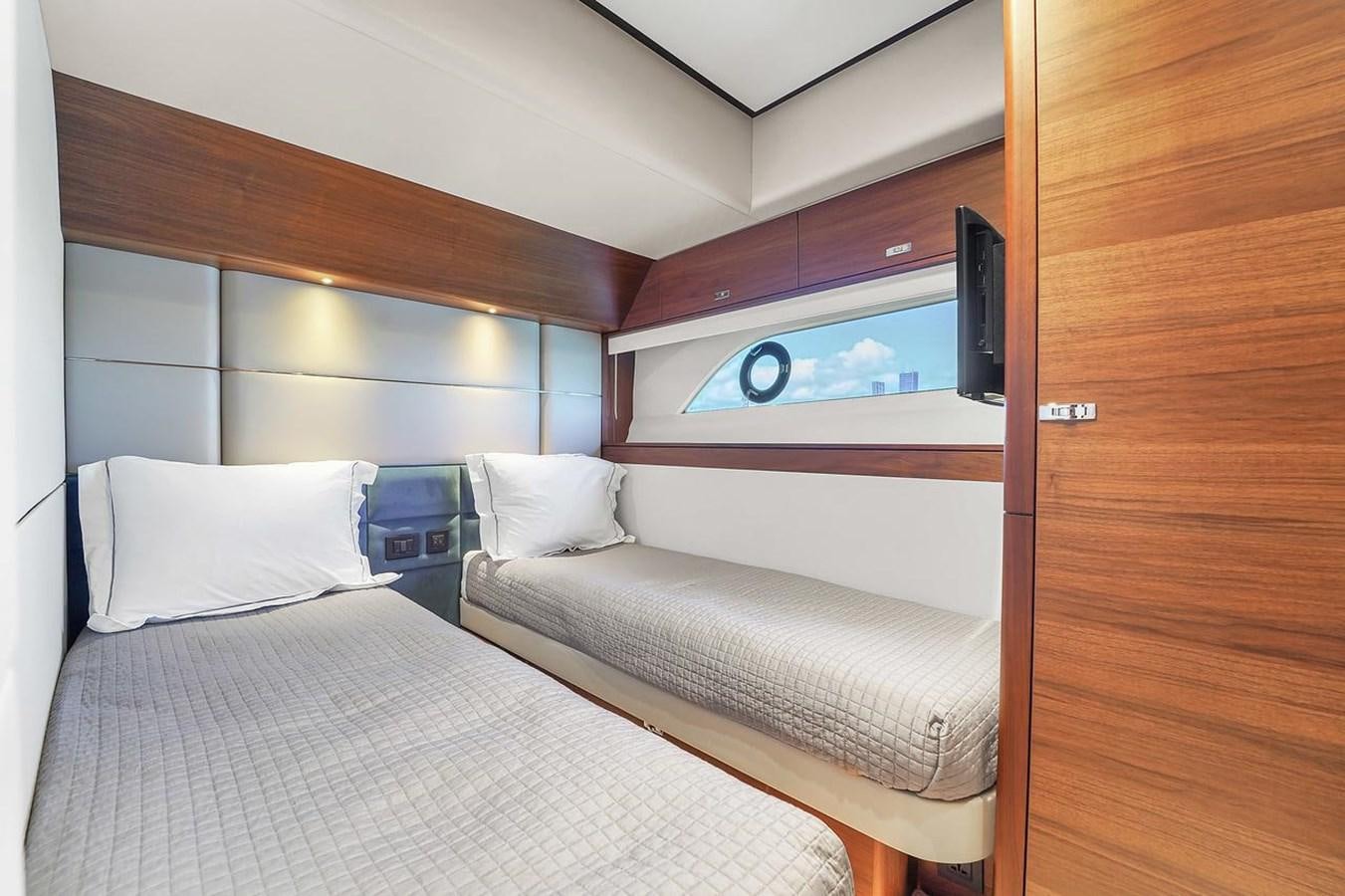 a room with two beds aboard 78' PRINCESS Y78 2021 Yacht for Sale