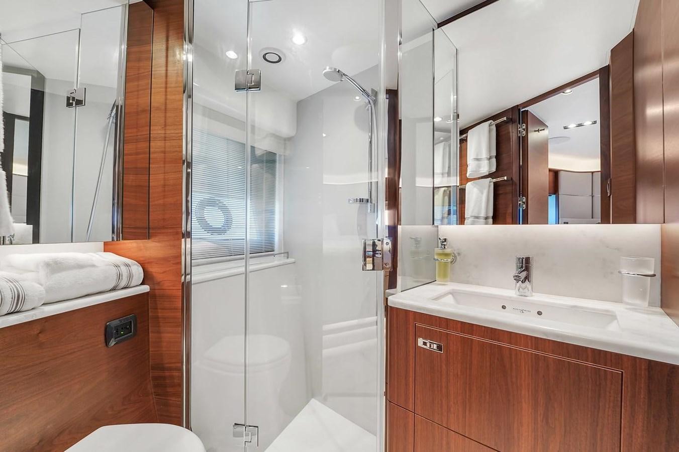 a bathroom with a shower unit and sink aboard 78' PRINCESS Y78 2021 Yacht for Sale