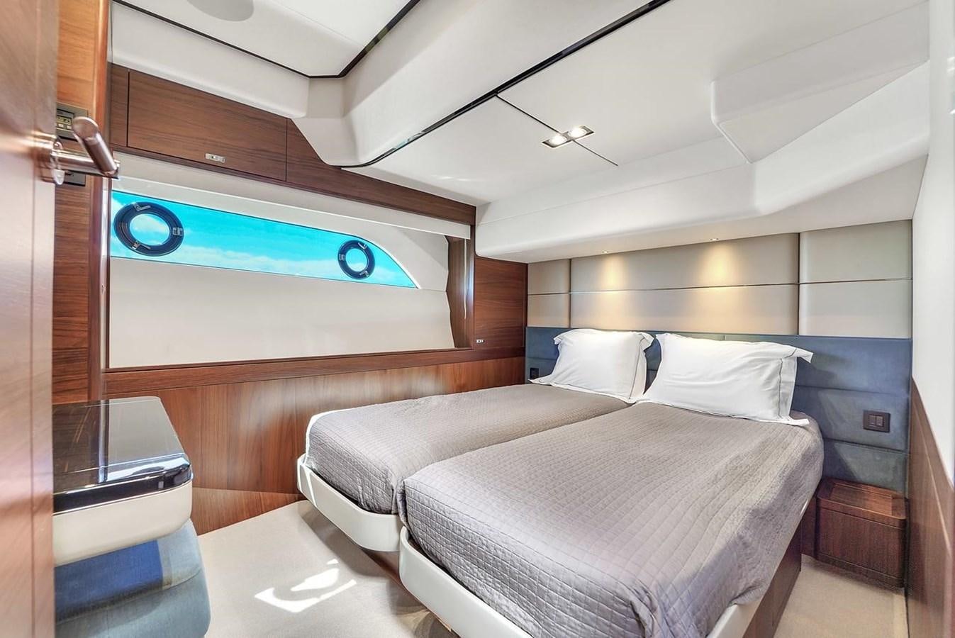 a room with a bed and a desk aboard 78' PRINCESS Y78 2021 Yacht for Sale