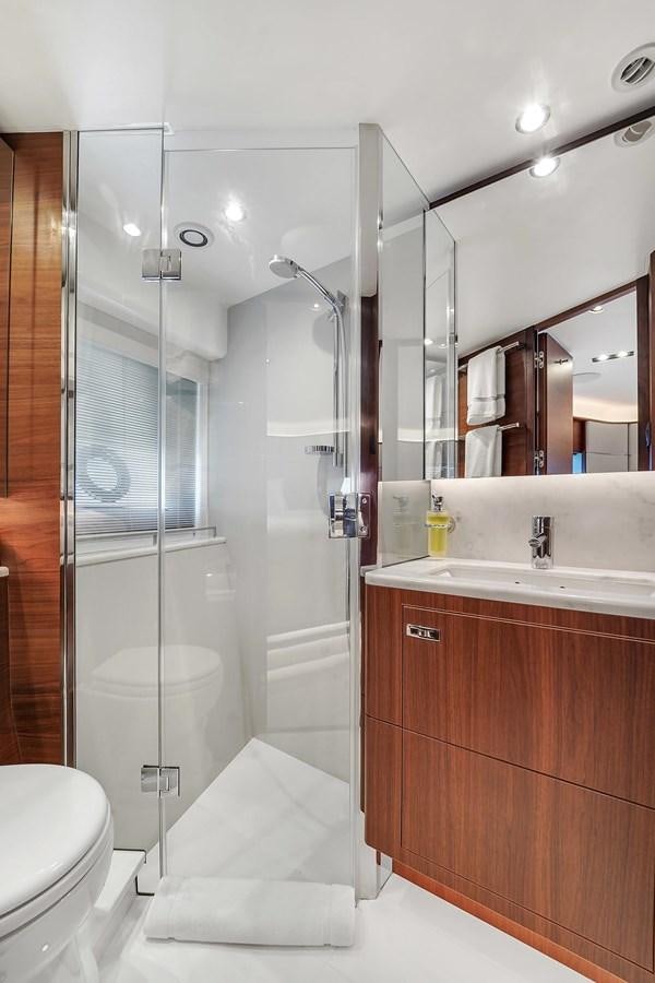 a bathroom with a glass shower aboard 78' PRINCESS Y78 2021 Yacht for Sale