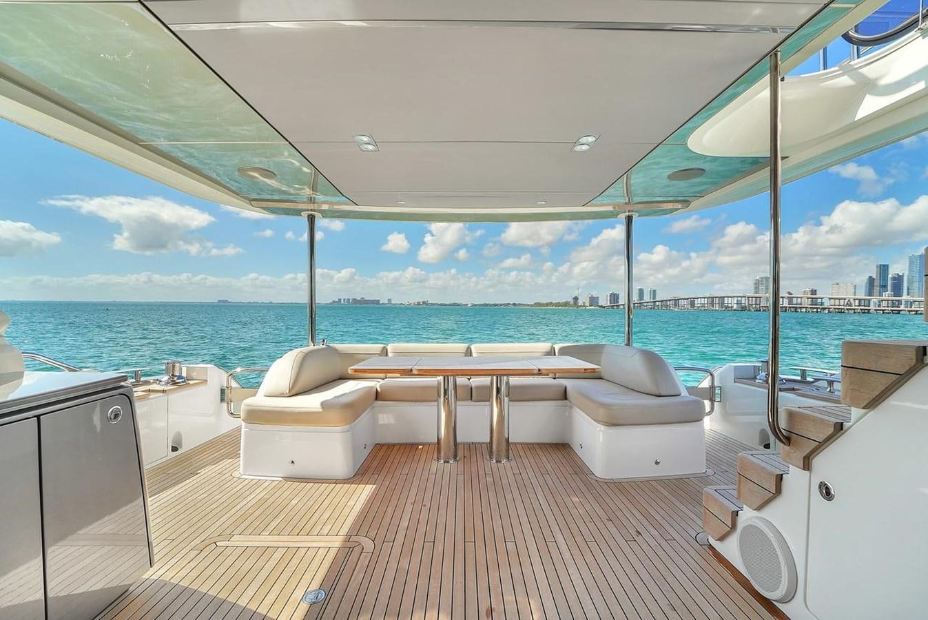 a room with a bed and a table and chairs aboard 78' PRINCESS Y78 2021 Yacht for Sale