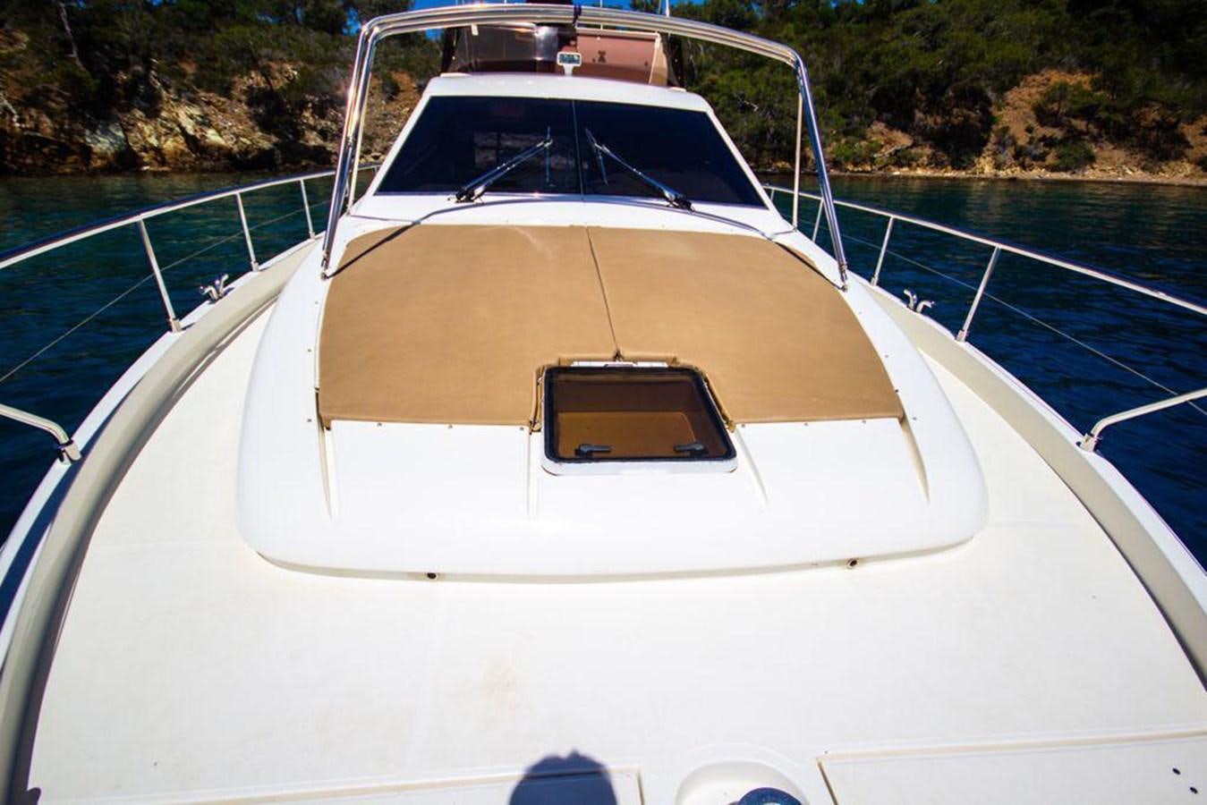 a white boat on a river aboard FERRETTI 760 Yacht for Sale