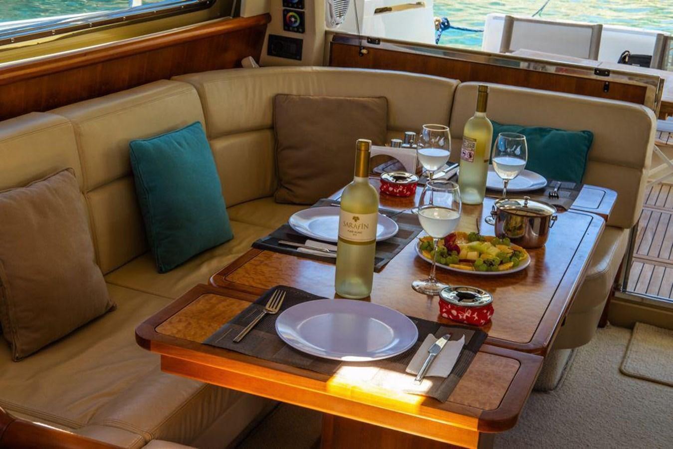 a table with food and plates on it aboard FERRETTI 760 Yacht for Sale