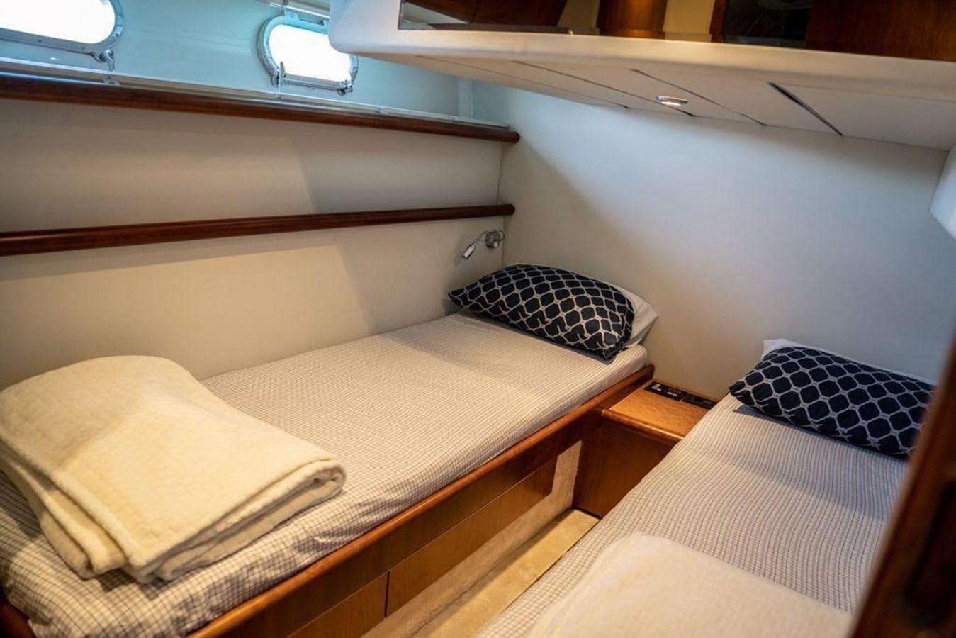 a couple of beds in a room aboard FERRETTI 760 Yacht for Sale