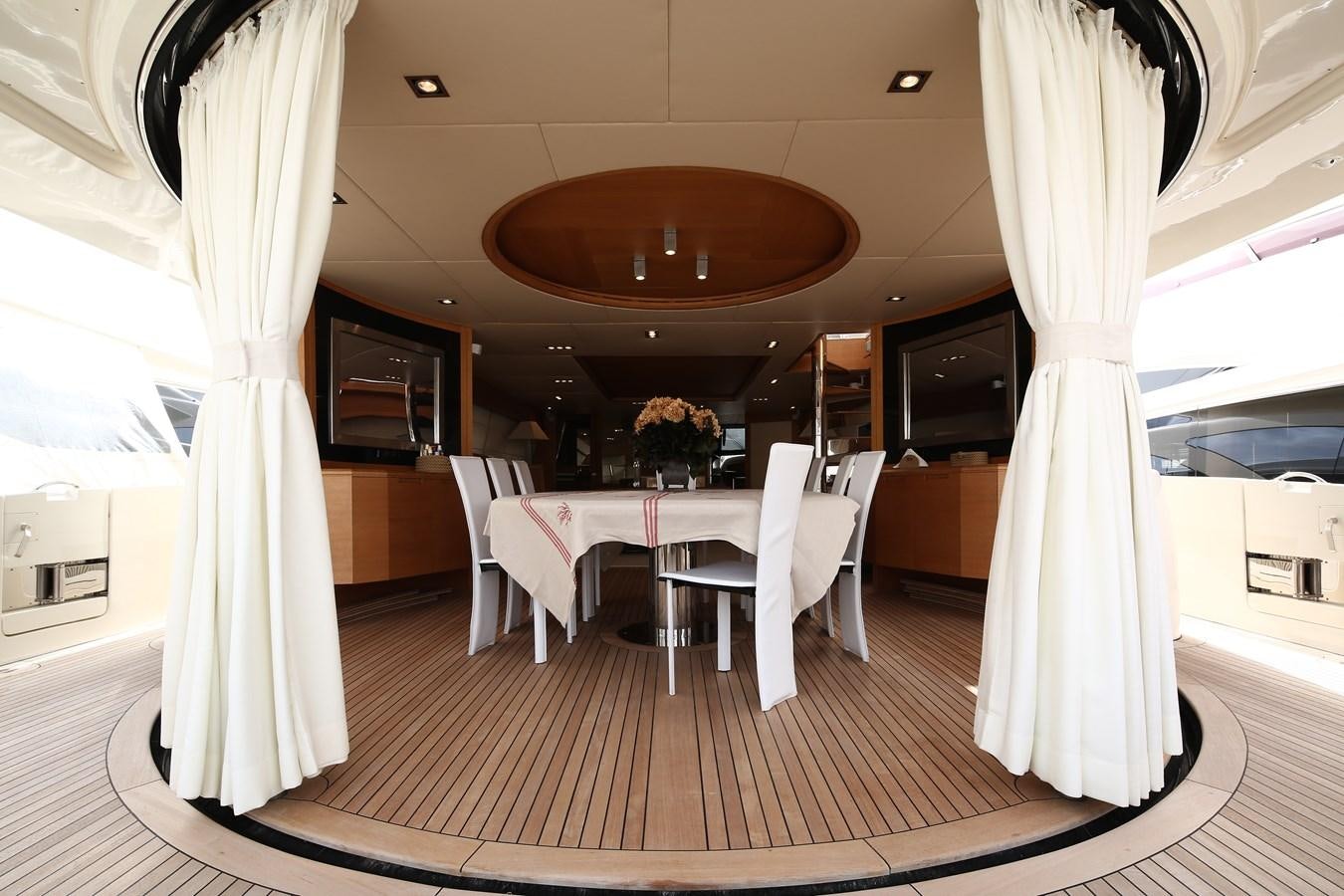 a room with a table and chairs aboard 100 LEONARDO Yacht for Sale