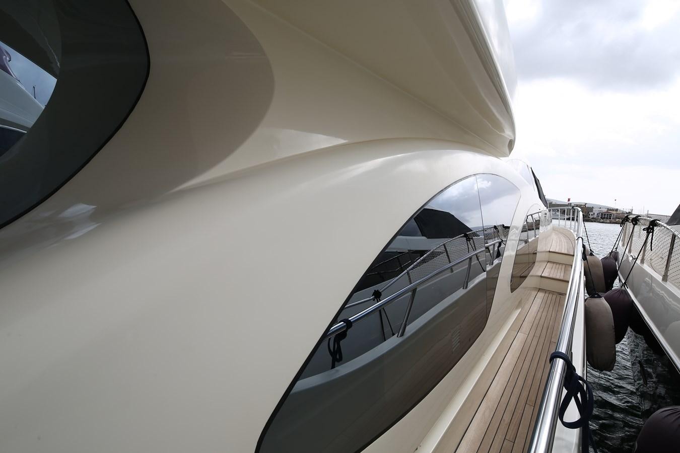 a white car with a door open aboard 100 LEONARDO Yacht for Sale