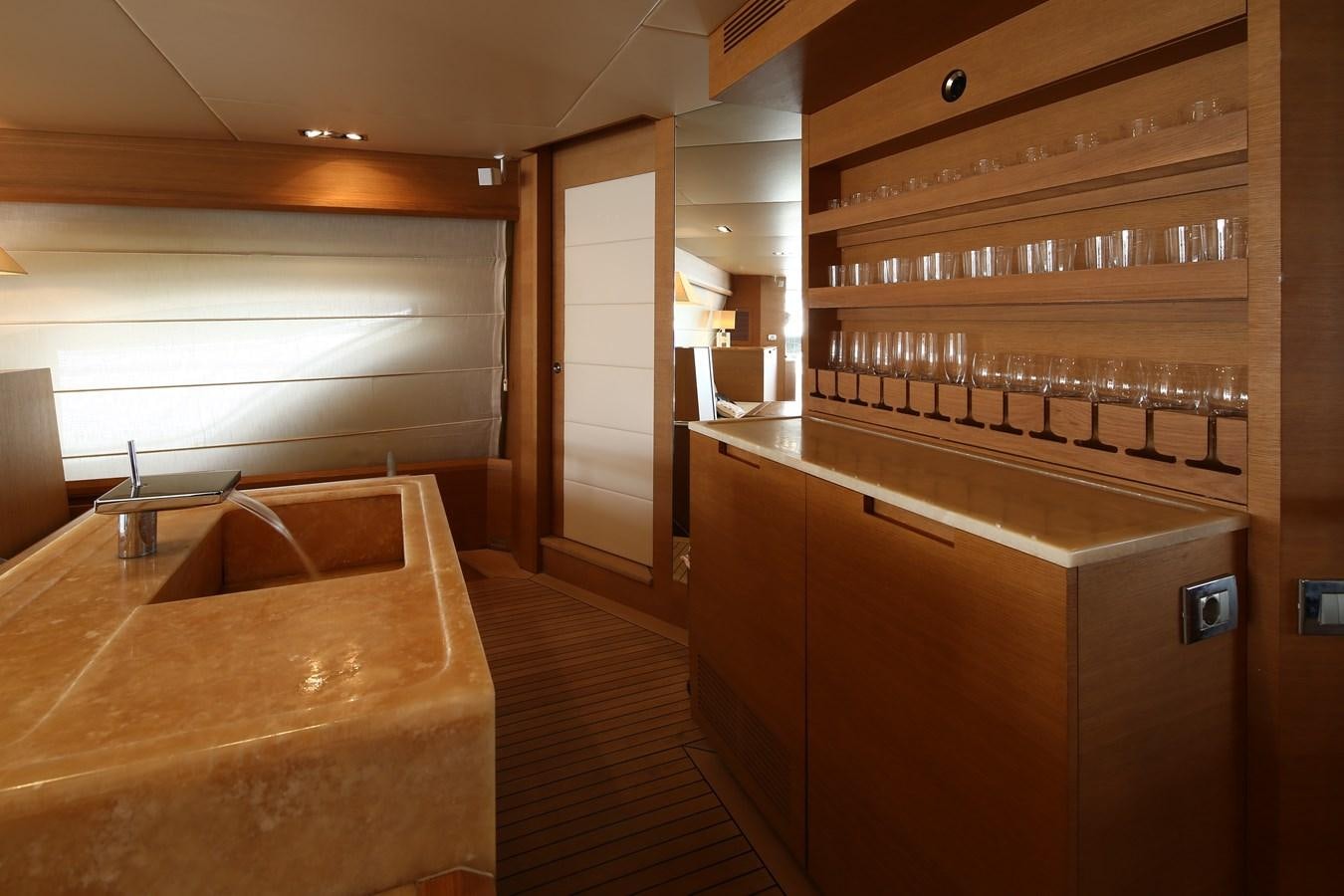 a wine bar in a room aboard 100 LEONARDO Yacht for Sale