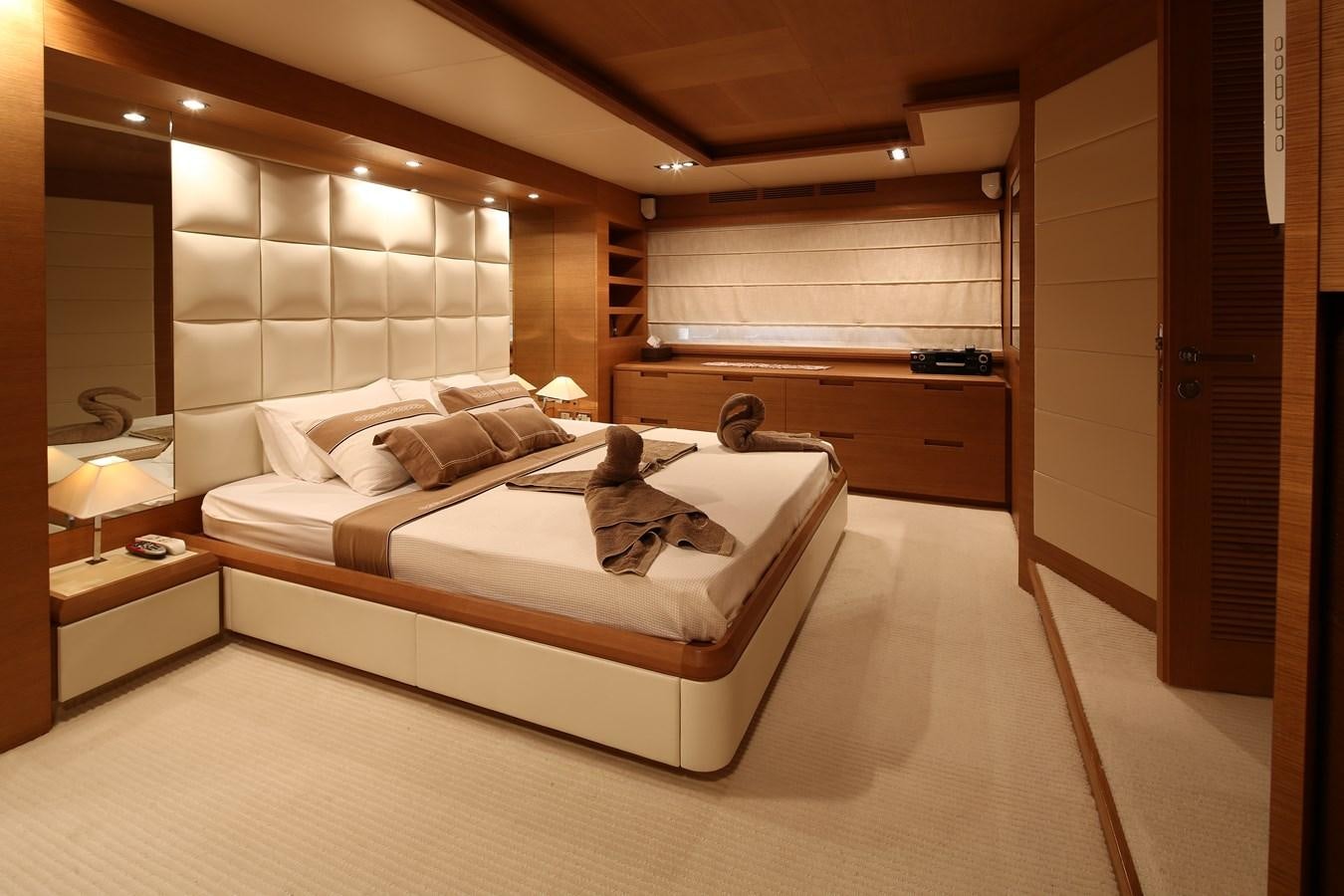 a large hotel room with a large bed aboard 100 LEONARDO Yacht for Sale