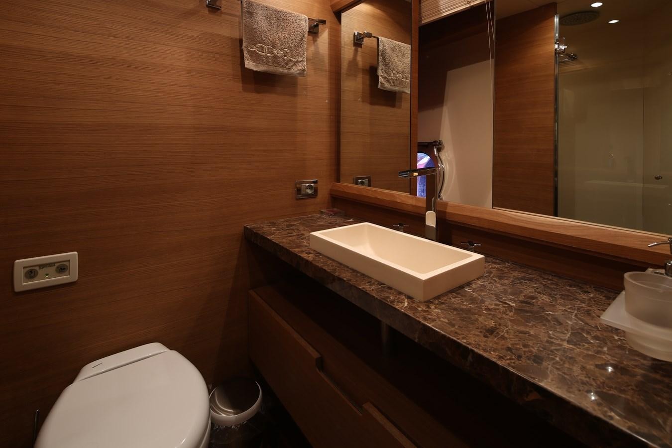 a bathroom with a sink and a toilet aboard 100 LEONARDO Yacht for Sale