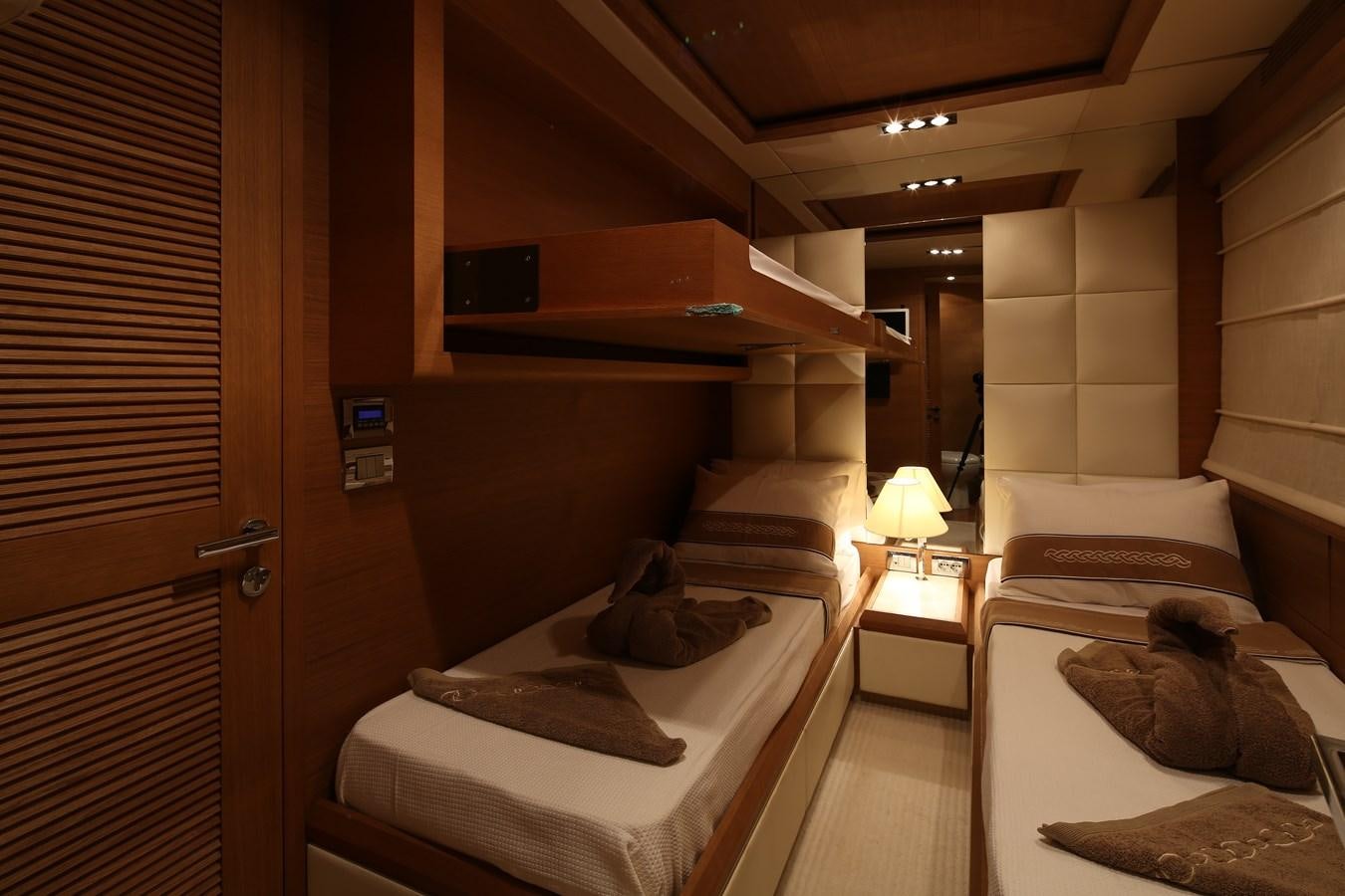 a room with a bed and a desk aboard 100 LEONARDO Yacht for Sale