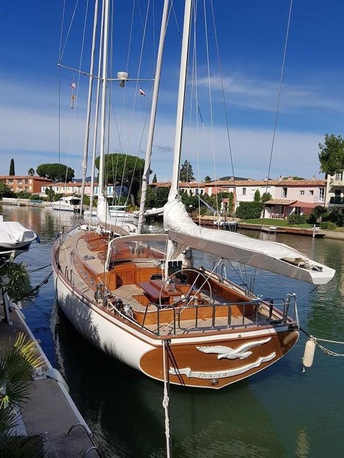 a boat docked in a harbor aboard TIOGA OF HAMBURG Yacht for Sale