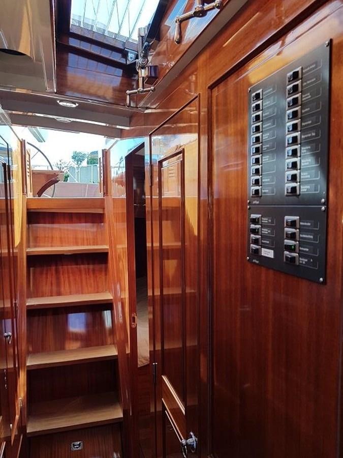 a wooden cabinet with a vent aboard TIOGA OF HAMBURG Yacht for Sale