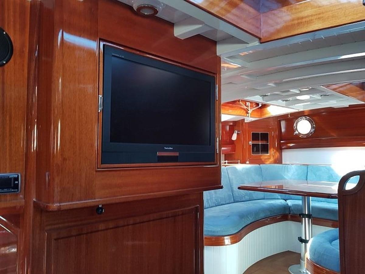 a tv on a cabinet aboard TIOGA OF HAMBURG Yacht for Sale