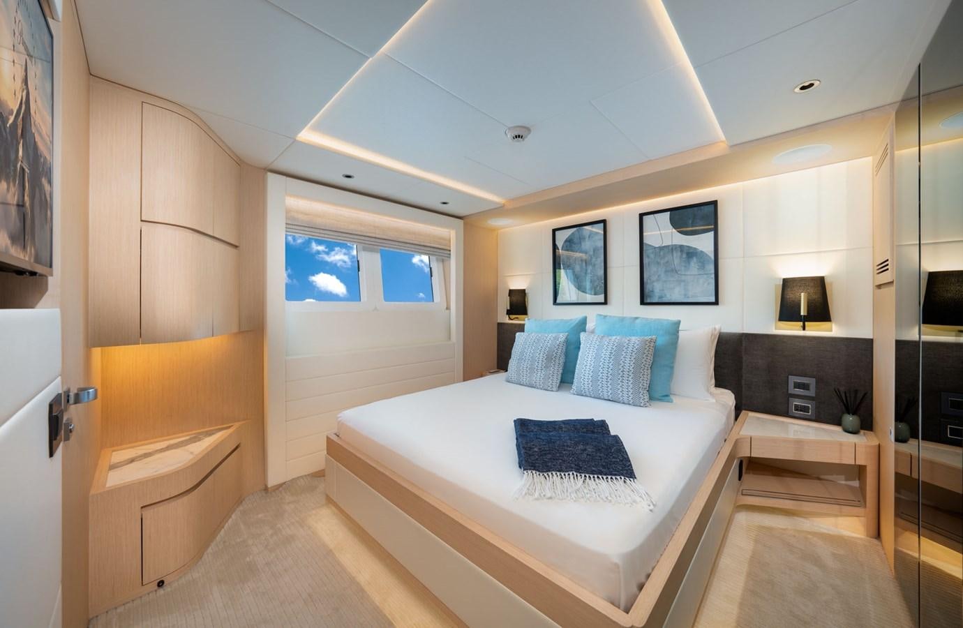 a bedroom with a bed aboard SANTOSH Yacht for Sale