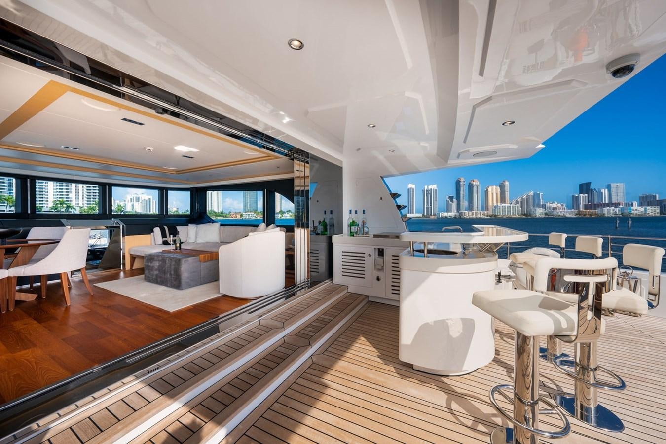 a large room with tables and chairs aboard SANTOSH Yacht for Sale