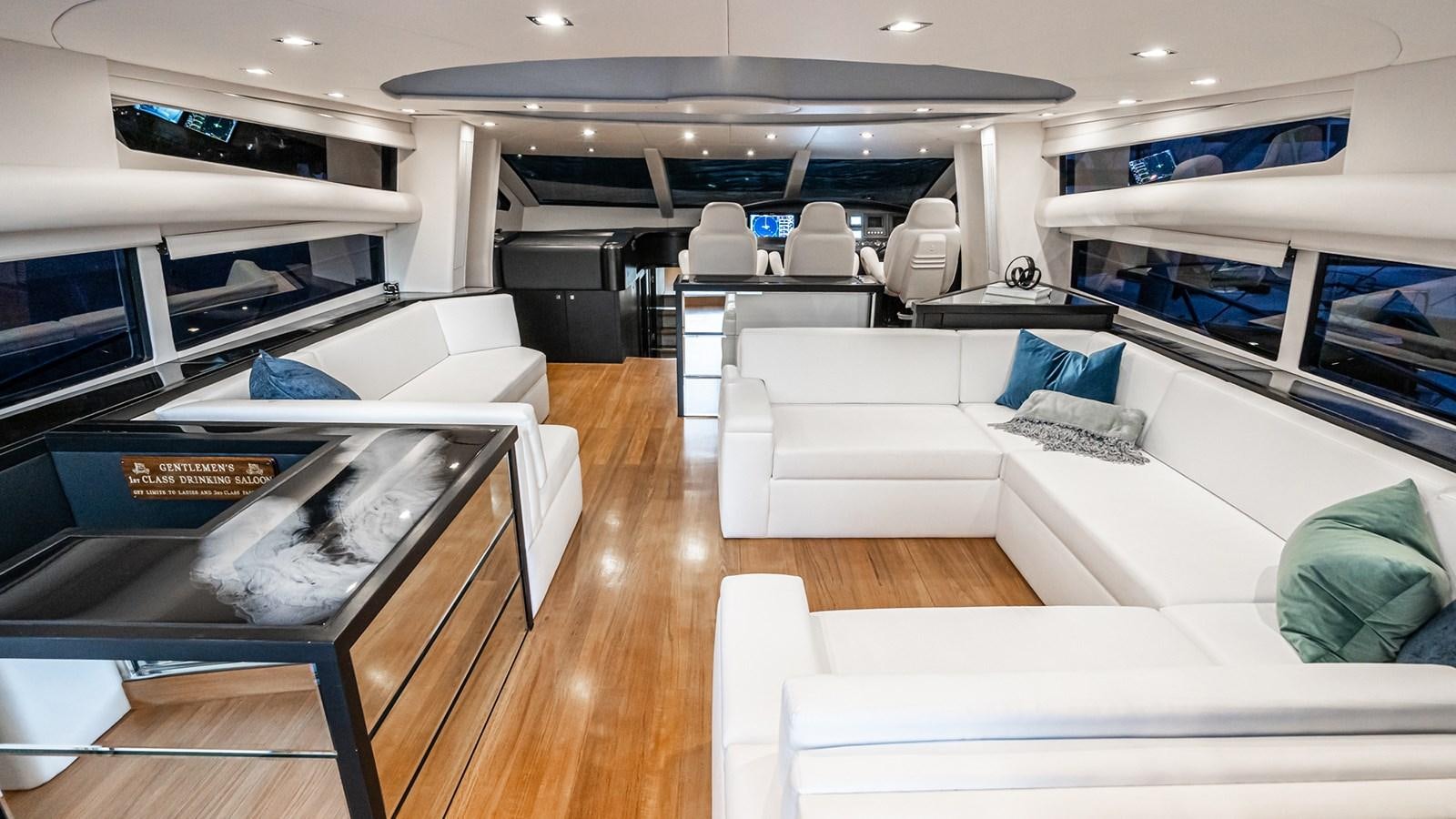 a room with a couch and a table aboard NORMA JEAN Yacht for Sale