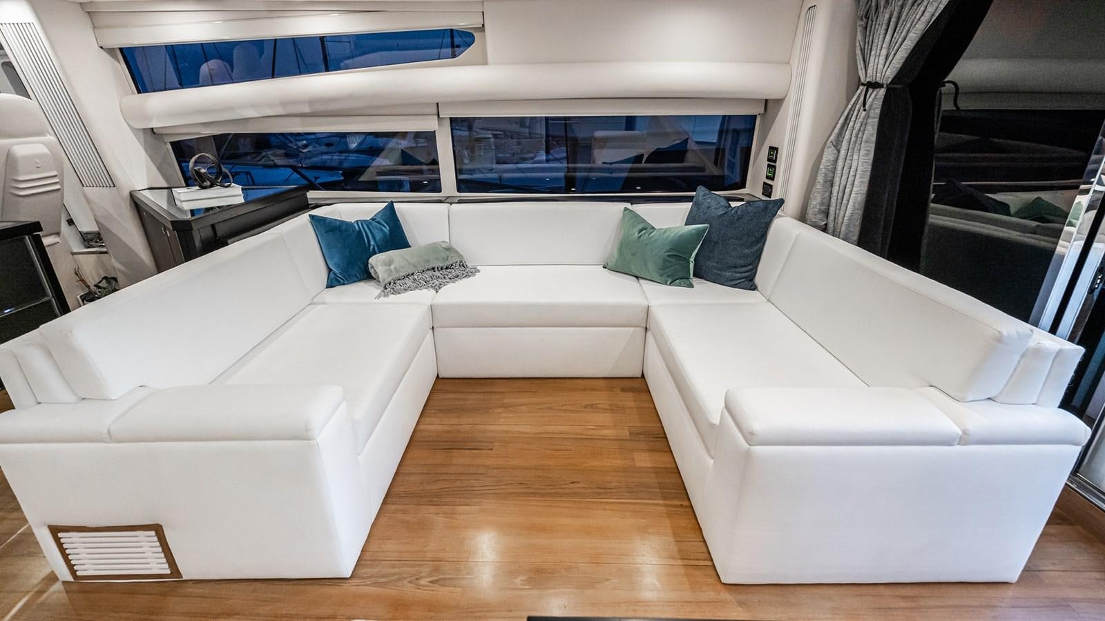 a room with a bed and a couch aboard NORMA JEAN Yacht for Sale