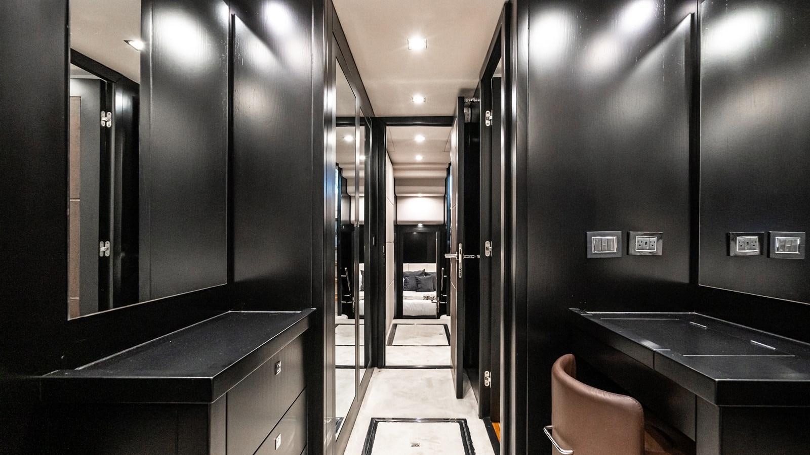 a room with a counter and chairs aboard NORMA JEAN Yacht for Sale