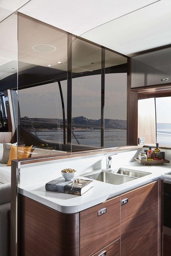 a kitchen with a large window aboard SHINE Yacht for Sale
